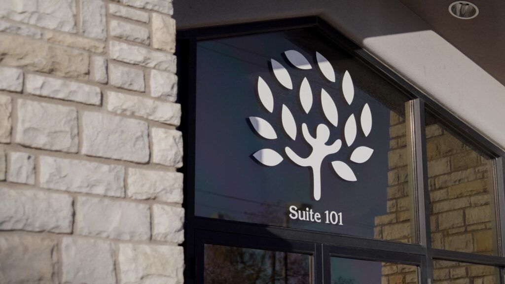 Treetop ABA Therapy Center building entrance with logo on glass door