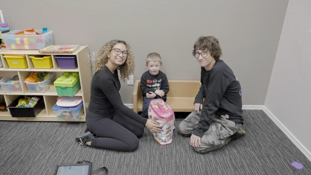 Two Treetop ABA therapists working one-on-one with a child